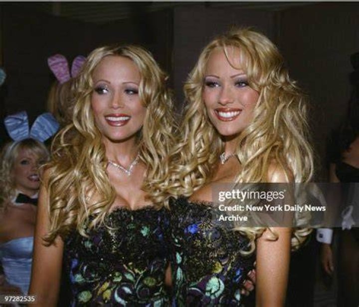 Twins Mandy and Sandy Bentley with Hugh Hefner at a press conference